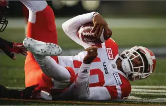  ?? CANADIAN PRESS FILE PHOTO ?? B.C. Lions’ Jonathon Jennings hits the ground after being sacked during CFL action against the Stampeders on Saturday. The Lions’ offence — expected to be lethal this season — has been anything but.