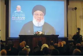  ?? (Aziz Taher/Reuters) ?? HEZBOLLAH CHIEF Hassan Nasrallah addresses supporters in Beirut via video on Friday.