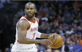  ?? SUE OGROCKI — THE ASSOCIATED PRESS FILE ?? In this file photo, Houston Rockets guard Chris Paul moves the ball during the team’s NBA basketball game against the Oklahoma City Thunder in Oklahoma City. Paul says he’s staying with the Rockets. The star point guard wasted no time once the free...