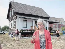 ?? FRED THORNHILL THE CANADIAN PRESS ?? Annette Dionne, one of two surviving Dionne quintuplet­s, visits the original cabin she was born in, relocated to downtown North Bay.