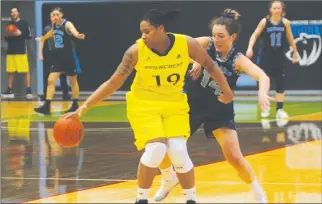  ?? Herald photo by Dale Woodard ?? Lethbridge College Kodiak Courtney Peterson guards against Briercrest Clipper Sylvia Smith-Gatson late in the fourth quarter of Alberta College Athletic Conference play Saturday afternoon at the Val Matteotti Gymnasium.