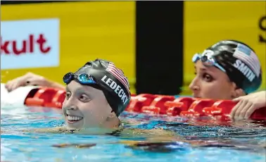  ?? KOJI SASAHARA/AP PHOTO ?? U.S. swimmer Katie Ledecky, left, reacts after winning the women’s 400 meter freestyle final during the Pan Pacific swimming championsh­ips on Saturday at Tokyo. At right is Leah Smith of the U.S.