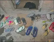  ??  ?? Footwear of police officers lie outside in the Indian state of Mizoram.