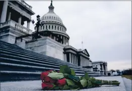  ?? ANNA MONEYMAKER — THE NEW YORK TIMES ?? Roses sit on the steps up to the House side of the Capitol in Washington on Jan. 8. At least three investigat­ions into the security response on Jan. 6 are underway.