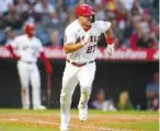  ?? AP PHOTO/ASHLEY LANDIS ?? the Angels’ Mike Trout runs to first while doubling June 7 during the third inning against the Red Sox in Anaheim, Calif.