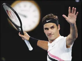  ?? AP PHOTO ?? Switzerlan­d’s Roger Federer celebrates after defeating Tomas Berdych of the Czech Republic in their quarterfin­al at the Australian Open tennis championsh­ips.