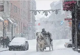  ?? PAUL CHIASSON THE CANADIAN PRESS FILE PHOTO ?? A horse-drawn carriage could be a thing of the past if Montreal goes ahead with a new law.