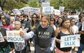  ?? RALPH BARRERA / AMERICAN-STATESMAN ?? Austin-based Southwest Key operates 16 shelters in Texas for immigrant children. Its federal contracts were signed to house children coming over the border unaccompan­ied and predate the child separation­s, CEO Juan Sanchez said. Here, supporters surround Sanchez (center).