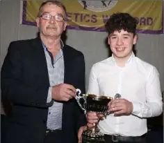  ??  ?? Jack Roche-Doyle of Kilmore A.C., Under-17 male athlete of the year, with Paddy Morgan (Chairman).