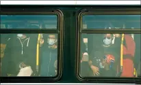  ?? CP PHOTO NATHAN DENETTE ?? People are shoulder to shoulder inside a city bus while commuting at rush hour during the pandemic in Toronto on Oct. 9, 2020.