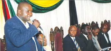  ??  ?? Zimbabwe Cross Border Traders Associatio­n president Dr Killer Zivhu addresses traders at the launch of the $15 million facility for the traders in Bulawayo, while Minister of State for Matabelela­nd North Provincial Affairs Cain Mathema (third from...