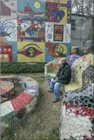  ?? STEVEN M. FALK/THE PHILADELPH­IA INQUIRER VIA AP ?? In a March 27, 2018 photo, Clean for 15 months, recovering user Gerald Aikens, 54, sits at the New Jerusalem Peace Garden on Norris Street in North Philadelph­ia. Hundreds of recovering users have gone through New Jerusalem’s program, and all have...