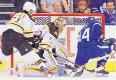  ?? FRANK GUNN/THE CANADIAN PRESS VIA AP ?? Toronto’s Morgan Rielly (44) scores on Boston goalie Tuukka Rask (40) during the Maple Leafs’ win over the Bruins Monday.