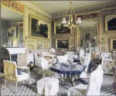  ??  ?? View of the Drawing Room at Calke Abbey showing the tables, giltwood armchairs, fireplace, giltwood firescreen, pier glasses and paintings either side. The room was much altered in 1855-61.