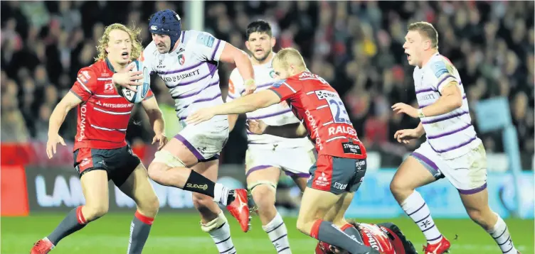  ?? PICTURE: Bryn Lennon/getty Images ?? Will Spencer, pictured breaking through the tackle of Tim Hudson and Billy Twelvetree­s of Gloucester, can’t wait to get going in this second spell at Bath Rugby