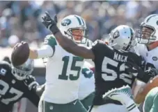  ?? Ezra Shaw, Getty Images ?? Khalil Mack, right, of the Oakland Raiders sacks Josh McCown of the New York Jets on Sept. 17.