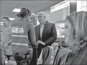  ?? AP/SUSAN WALSH ?? Vice President Mike Pence speaks with workers Sunday during a visit to the Federal Emergency Management Agency headquarte­rs in Washington to see the response to Hurricane Irma.