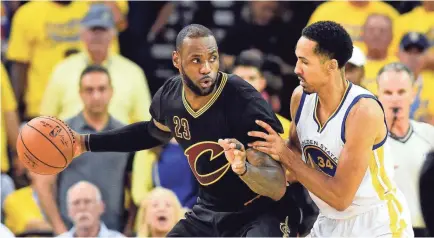  ?? BOB DONNAN/USA TODAY SPORTS ?? LeBron James and Shaun Livingston mix it up in Game 7 of the 2016 NBA Finals.