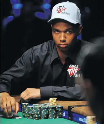  ?? ROBYN BECK / AFP / GETTY IMAGES ?? Phil Ivey plays a hand at the 2009 World Series of Poker in Las Vegas. The poker champion has lost at the British Supreme Court, which ruled he was cheating when he asked dealers to rotate cards.