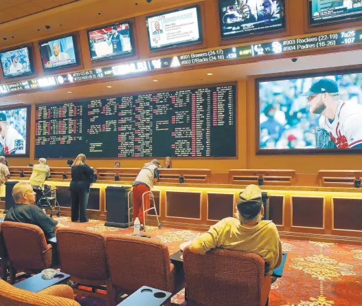  ?? JOHN LOCHER/ASSOCIATED PRESS PHOTOS ?? At the South Point hotel and casino, above, in Las Vegas , sports betting has been legal for many years. It remains to be seen how many other states will follow.