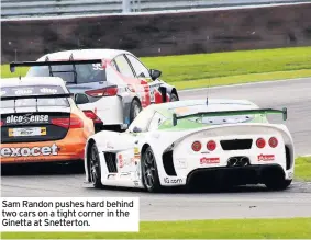  ??  ?? Sam Randon pushes hard behind two cars on a tight corner in the Ginetta at Snetterton.