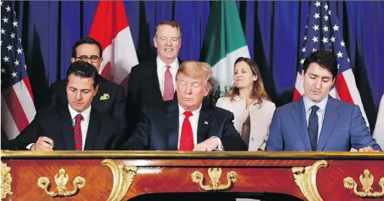  ?? PABLO MARTINEZ MONSIVAIS/THE ASSOCIATED PRESS ?? From left, Mexico’s President Enrique Peña Nieto, U.S. President Donald Trump and Prime Minister Justin Trudeau participat­e in the USMCA signing ceremony on Friday. Trump is viewed as using his threat of terminatin­g NAFTA as leverage to force the Democratic Congress to approve its replacemen­t, the USMCA.