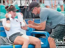  ?? LYNNE SLADKY/AP PHOTO ?? In this March 21, 2019 file photo, Bianca Andreescu, left, talks with her coach Sylvain Bruneau during her match against Irina Camelia Begu at the Miami Open in Miami Gardens, Fla.