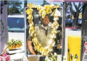  ?? Amy Osborne / Special to The Chronicle ?? A photo of UPS driver Mike Lefiti is part of a memorial in San Francisco’s Diamond Heights.