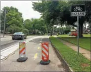  ?? EVAN BRANDT — DIGITAL FIRST MEDIA ?? The entrance to the bike lane on Roland Street off Beech Street, has a concrete barrier for the curve separating bike traffic from cars.