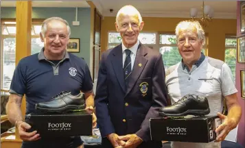  ??  ?? Tom O’Connor and Michael Lee, winners of the Theatre Tavern open fourball in New Ross, with the Captain, Martin Carroll (centre).