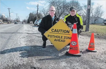  ?? BOB TYMCZYSZYN THE ST. CATHARINES STANDARD ?? CAA Niagara president and CEO Peter Van Hezewyk and Niagara Regional Police Staff-Sgt. Rom Diegidio at the launch of CAA’s Worst Roads campaign.