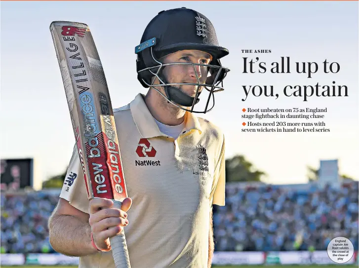  ??  ?? England captain Joe Root salutes the crowd at the close of play