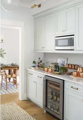  ??  ?? |TOP RIGHT| HANDY DETAILS. An added butler’s pantry seamlessly connects the kitchen to the dining room, with ample storage and a beverage fridge.