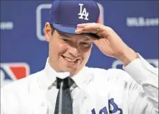  ?? Alex Brandon/Associated Press ?? Free agent pitcher Rich Hill signed a three-year deal Monday with the Los Angeles Dodgers.