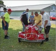  ?? SUBMITTED PHOTO - CARL HESS ?? Getting into a Messerschm­itt is more like putting it on. This one, a 1956 KR200 Sport, belongs to Thomas Harpel of Bethlehem, was on display on July 14 at the Oley Fairground­s for the 14th annual Deutsche Classic AllGerman Automotive and Motorcycle Show.