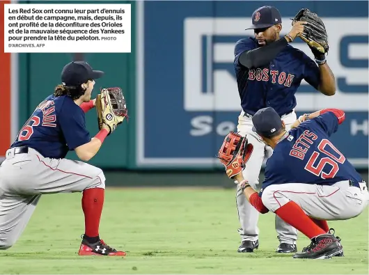  ?? D’ARCHIVES, AFP PHOTO ?? Les Red Sox ont connu leur part d’ennuis en début de campagne, mais, depuis, ils ont profité de la déconfitur­e des Orioles et de la mauvaise séquence des Yankees pour prendre la tête du peloton.