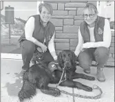  ?? ?? In the image Kourt1, the dog is pictured with her VWSU co-handlers, Catherine Pooley, left, and Vicky Snider.