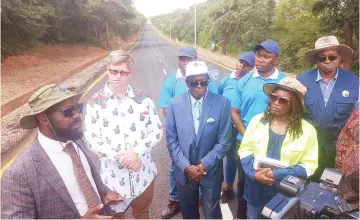  ?? Picture: Edward Zvemisha - ?? Transport and Infrastruc­ture Developmen­t Deputy Minister, Joshua Sacco (second from left), Minister of State for Provincial Affairs and Devolution for Harare Metropolit­an Province Charles Tawengwa (third from left) and Transport and Infrastruc­tural Developmen­t Permanent Secretary Engineer Joy Makumbe (right) listen while Gutu East MP Benjamin Ganyiwa (left) speaks during the official opening of access roads to the National Heroes Acre in Harare on Friday.