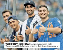  ?? AP ?? TWO FOR THE SHOW: In a rare occurrence, both Yankees and Mets fans are enjoying their teams’ seasons.