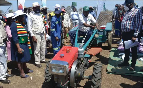  ?? - Picture by Tinai Nyadzayo ?? Minister of State for Manicaland Provincial Affairs and Devolution, Honourable Nokuthula Matsikenye­re (left); Lands, Agricultur­e, Fisheries, Water and Rural Developmen­t Minister, Dr Anxious Masuka (second from left) and other Government officials inspect a 16 horsepower two-wheel tractor during the launch of the Presidenti­al Goat Scheme in Chipinge last Friday.