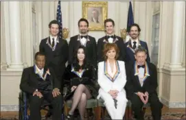  ?? KEVIN WOLF — THE ASSOCIATED PRESS ?? 2018 Kennedy Center Honorees, front row form left, Wayne Shorter, Cher, Reba McEntire, Philip Glass, back row from left, the co-creators of “Hamilton,” Thomas Kail, Lin-Manuel Miranda, Andy Blankenbue­hler, Alex Lacamoire pose for the group photo at the State Department for the Kennedy Center Honors State Department Dinner on Saturday in Washington.