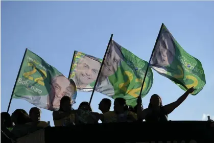  ?? Photograph: Eraldo Peres/AP ?? As Sunday’s run-off ballot approaches, President Jair Bolsonaro has openly admitted he gave money to legislator­s.