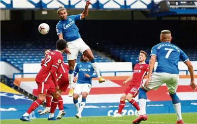  ?? — AFP ?? On a high: Everton’s Dominic Calvert-Lewin scoring his team’s second goal during the match against Liverpool at Goodison Park.