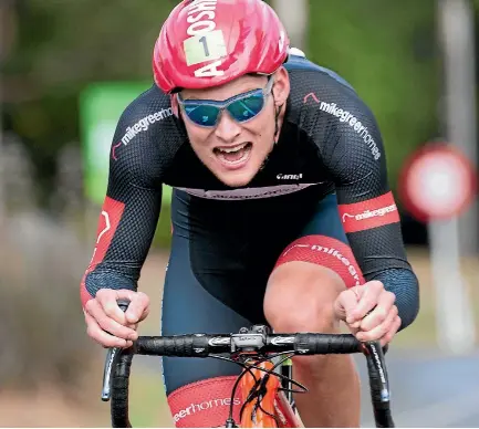  ?? 29 22 19 10 9 5 PHOTO: BARRY HARCOURT ?? The effort shows as Southland’s Matt Zenovich wins the individual time trial stage from Manapouri to Anau during the Tour de Lakes.