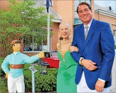  ?? PHOTOS PROVIDED ?? Marylou Whitney and John Hendrickso­n sponsored two of the 37 lawn jockeys in a new display outside the National Museum of Racing and Hall of Fame.