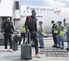  ??  ?? Going home: Kevin Trapp, left, and Jerome Boateng in
Frankfurt yesterday