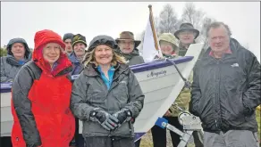  ??  ?? Members of KIDs coastal rowing club, including Gordon Leveratt, right, and Mingulay, the boat he built and which launched the club.