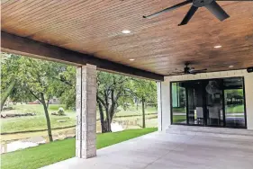  ??  ?? Covered back patio at 2229 Stone Mill Court, Yukon.