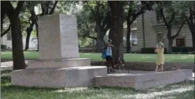  ?? ERIC GAY, FILE — ASSOCIATED PRESS ?? In this Aug. 21, 2017 file photo, a pedestal wrapped in plastic that had held a statue of Confederat­e Gen. Robert E. Lee which was removed from the University of Texas campus in Austin, Texas.