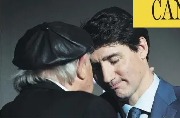  ?? NATHAN DENETTE / THE CANADIAN PRESS ?? Prime Minister Justin Trudeau shares a moment with Holocaust survivor Nate Leipciger after delivering remarks at the March of Living 30th anniversar­y gala in Toronto on Tuesday.